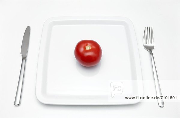 Teller mit Tomate
