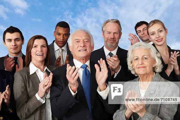 Businesspeople clapping