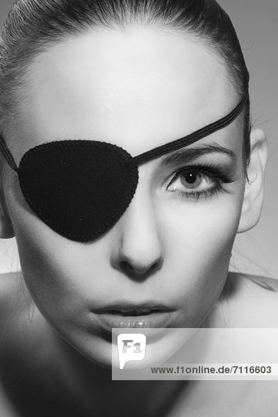 Young woman with eyepatch  portrait