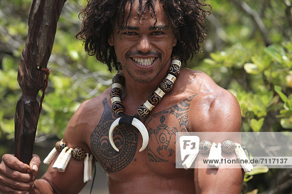 Tattooed man performing a war dance  Ua Pou  Marquesas Islands  French Polynesia  Polynesia  South Pacific  Oceania