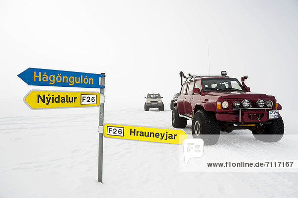 Snow-covered signpost Super Jeep in a winter landscape Vatnajoekull Glacier Icelandic Highlands Iceland Europe