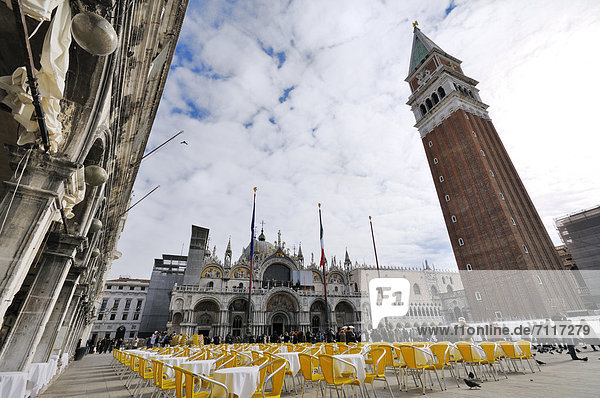 Chairs and tables on St. Mark's Square  St. Mark's Basilica and St Mark's Campanile  Venice  Venice  Veneto  Italy  Europe