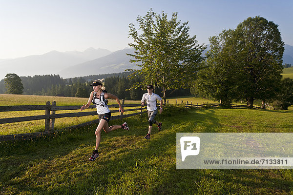 Trailrunning  Trail running  Trail  Ramsau  Dachstein  Styria  Austria  couple  woman  man  meadow  running  walking  run  jogging  sport  fitness  health