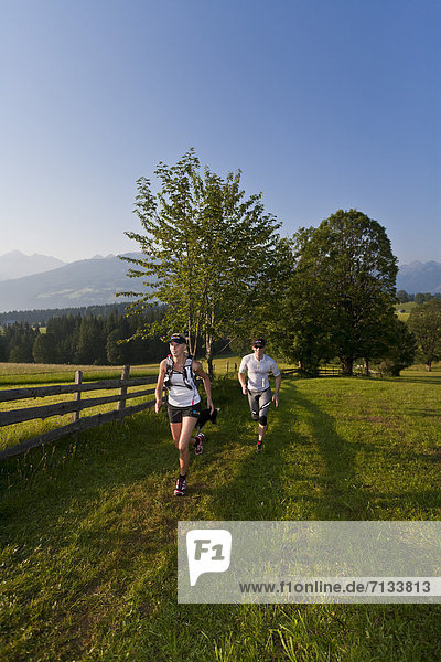 Trailrunning  Trail running  Trail  Ramsau  Dachstein  Styria  Austria  couple  woman  man  meadow  running  walking  run  jogging  sport  fitness  health
