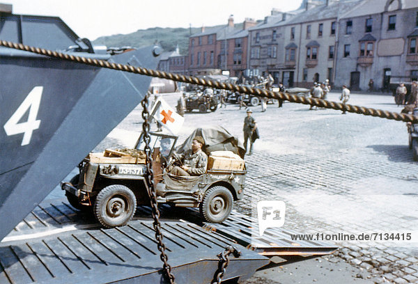 Operation  Overlord  Normandy  American  Army  Red Cross  jeep  loading  Landing Craft Transport  LCT  port  Southern England  invasion  France  World War II  Castletown  Portland  Dorset  United Kingdom  1944