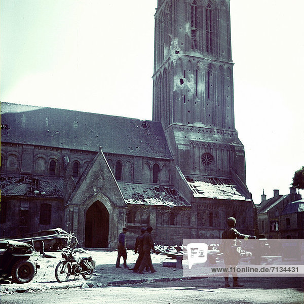 Operation  Overlord  Normandy  Canadian  soldier  directing  military  traffic  front  Church  Notre-Dame  Bernières-sur-Mer  Invasion  D-Day  World War II  Department Manche  1944