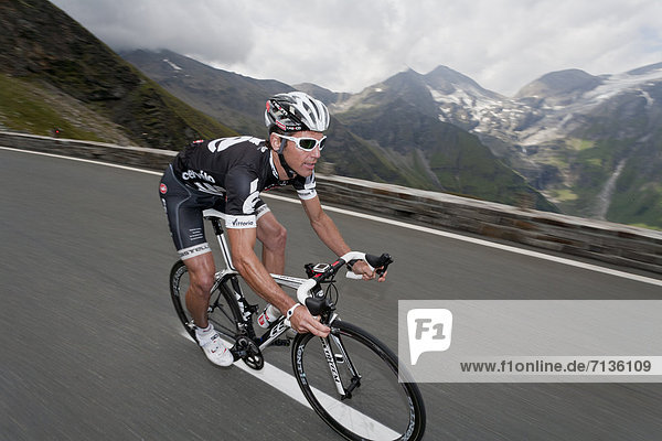 Austria  Europe  Grossglockner  Passtrasse  riding  bike  biking  bicycle  racing cycle  man  rise  sport  fitness  Pass  street