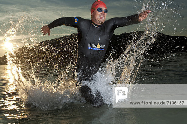 Austria  Europe  Ironman  man  sport  swimming suit  swimming  lake  Attersee  extreme sport  triathlon
