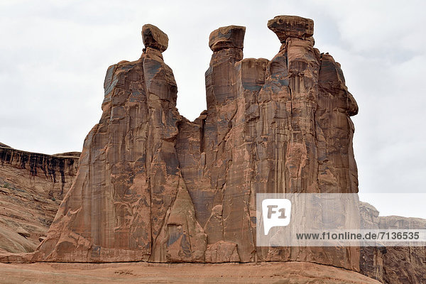 Three Gossips  rock formation of red sandstone  Arches National Park  Moab  Utah  USA