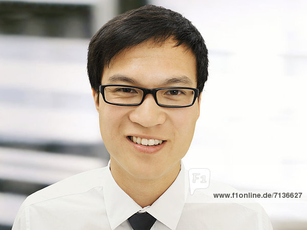 Young businessman  Asian  with glasses  smiling