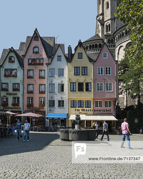 Colourful row of houses in Martinswinkel  with the Romanesque Great St. Martin Church at the rear  Am Fischmarkt  Fish Market square  historic town centre  Cologne  North Rhine-Westphalia  Germany  Europe  PublicGround