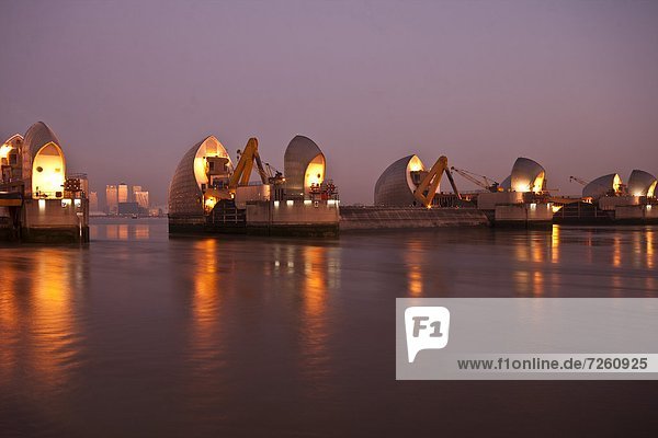 Thames Barrier and Canary Wharf at dawn  London  England  United Kingdom  Europe
