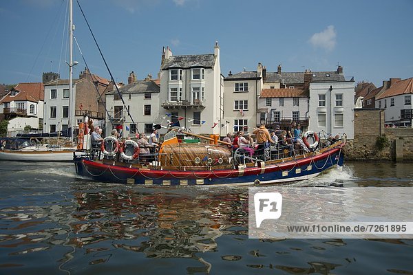 A colourful wooden sightseeing boat in Whitby Harbour in Yorkshire  England  United Kingdom  Europe