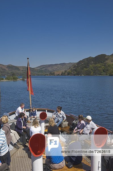 Tourists enjoying a steamer trip on Lake Ullswater  Lake Distrtict National Park  Cumbria  England  United Kingdom  Europe