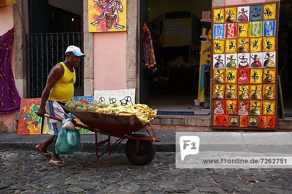 Fruit vendor in the cobbled streets of Largo de Pelourinho  Salvador  Bahia  Brazil  South America