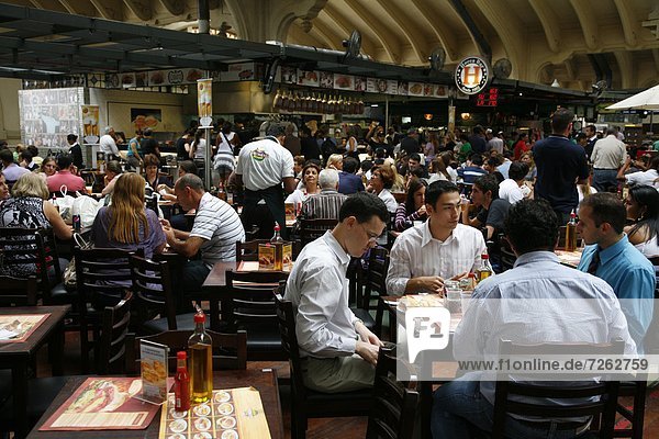 People sitting at a restaurant in Mercado Municipal  Sao Paulo  Brazil  South America