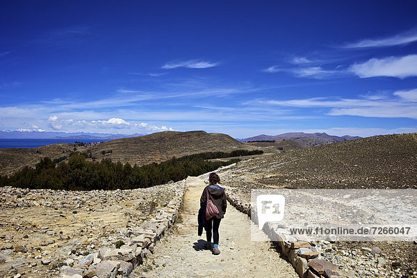 Walking down the path to the centre of the island  Isla del Sol  Lake Titicaca  Bolivia  South America
