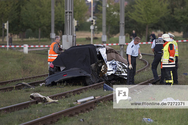 After a head-on collision a Peugeot car landed on the light railway tracks and caught fire  the driver burnt inside the wreckage  Ostfildern  Baden-Wuerttemberg  Germany  Europe