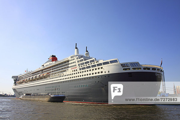 Leaving cruise ship Queen Mary 2 in the evening back light  Cruise Days 17  - 19.08.2012  Port of Hamburg  Hamburg  Germany  Europe