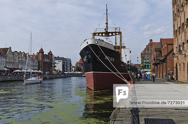 'View from Bleihof island of the Motlawa river  ship ''Soldek'' at front  first boat built in the Gdansk shipyard after the Second World War  Gdansk  Poland  Europe'