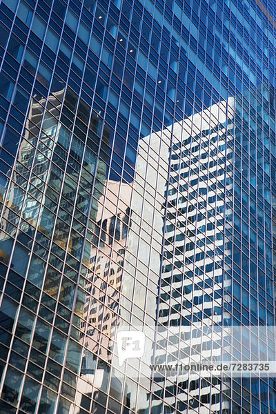 Other buildings reflected in skyscraper