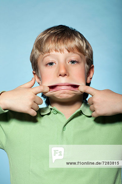 Boy pulling faces