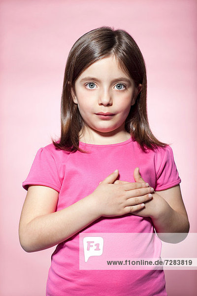 Girl with hands on heart