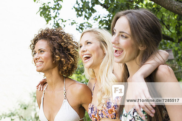 Smiling women standing together
