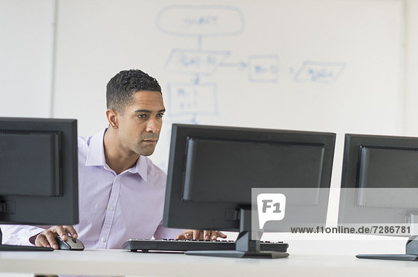 Male business executive working at desk
