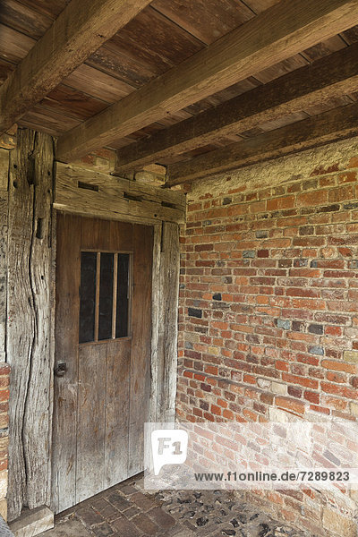 Old door and beams  entrance to the converted farmhouse at Bishop's Waltham Palace  Hampshire  England  United Kingdom  Europe