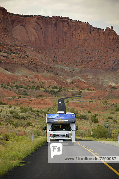 Motorhome on the U.S. Highway 24  large buckle of the Waterpocket Fold  Capitol Reef National Park  Utah  Southwestern USA  USA