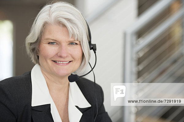 Geschäftsfrau  lächeln  Headset