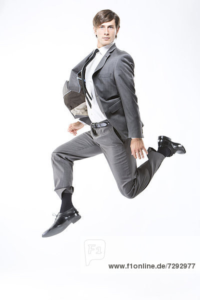 Businessman jumping  portrait