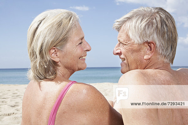 Spain,  Mallorca,  Happy senior couple at beach