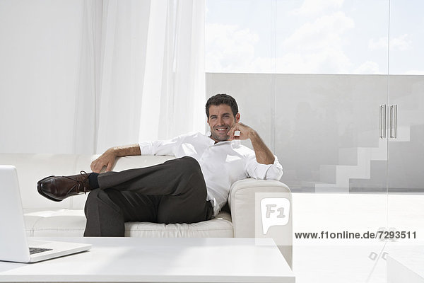 Spain  Businessman relaxing on couch