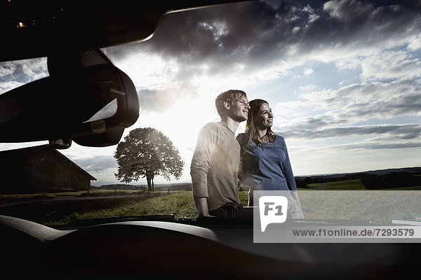 Germany  Bavaria  Couple standing by car