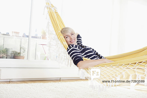 Woman relaxing in hammock  portrait
