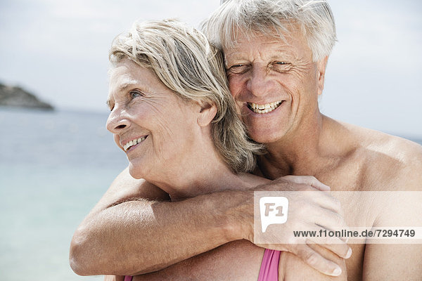 Spain  Senior couple embracing on beach