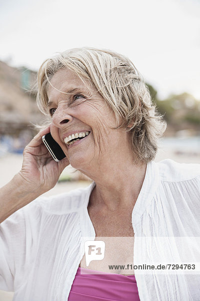Spain  Senior woman talking on mobile phone