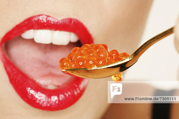 Woman enjoying caviar