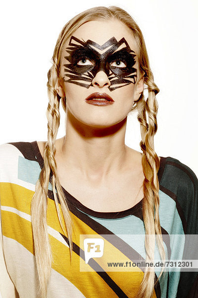 Young woman wearing extreme make-up