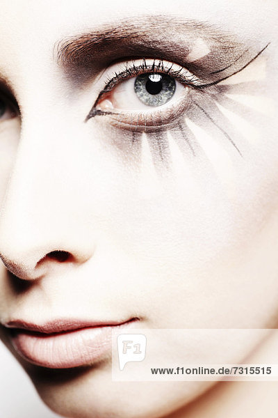 Woman  24  with striking eye makeup