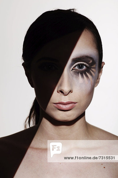 Woman  24  with striking eye makeup