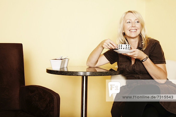 Woman  49  in a cafe