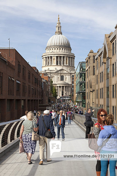 Tourists on the Millennium Bridge  Saint Paul's Cathedral at back  London  England  United Kingdom  Europe