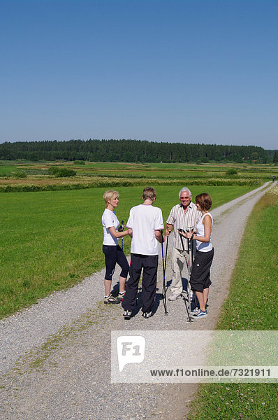 Young and old  Nordic Walking in the Allgaeu  Germany  Europe