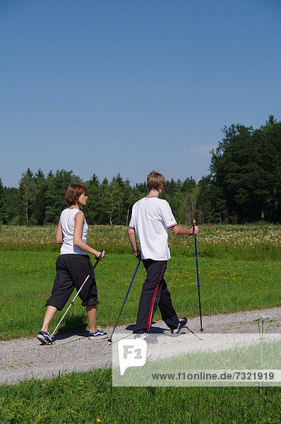 Young and old  Nordic Walking in the Allgaeu  Germany  Europe