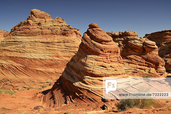'''The Cove'' Brain Rocks of the Coyote Buttes South CBS Cottonwood Teepees eroded Navajo sandstone rock formations with Liesegang bands or Liesegang rings Pareah Paria Plateau Vermilion Cliffs National Monument Arizona Utah Southwestern USA'