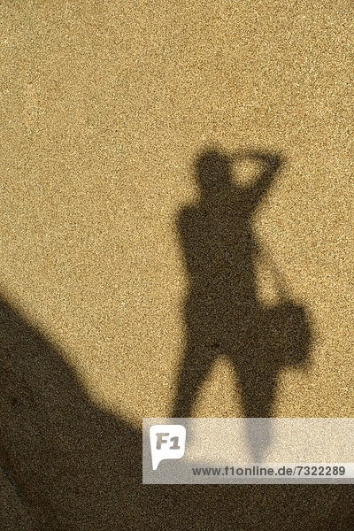 Shadow of a photographer on a monzogranite rock formation  Hidden Valley  Joshua Tree National Park  Mojave Desert  California  Southwest  United States of America  USA