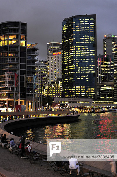 Evening mood  skyline of the Central Business District  CBD  people at Circular Quay East  Sydney Cove  Sydney Harbour  Sydney  New South Wales  NSW  Australia